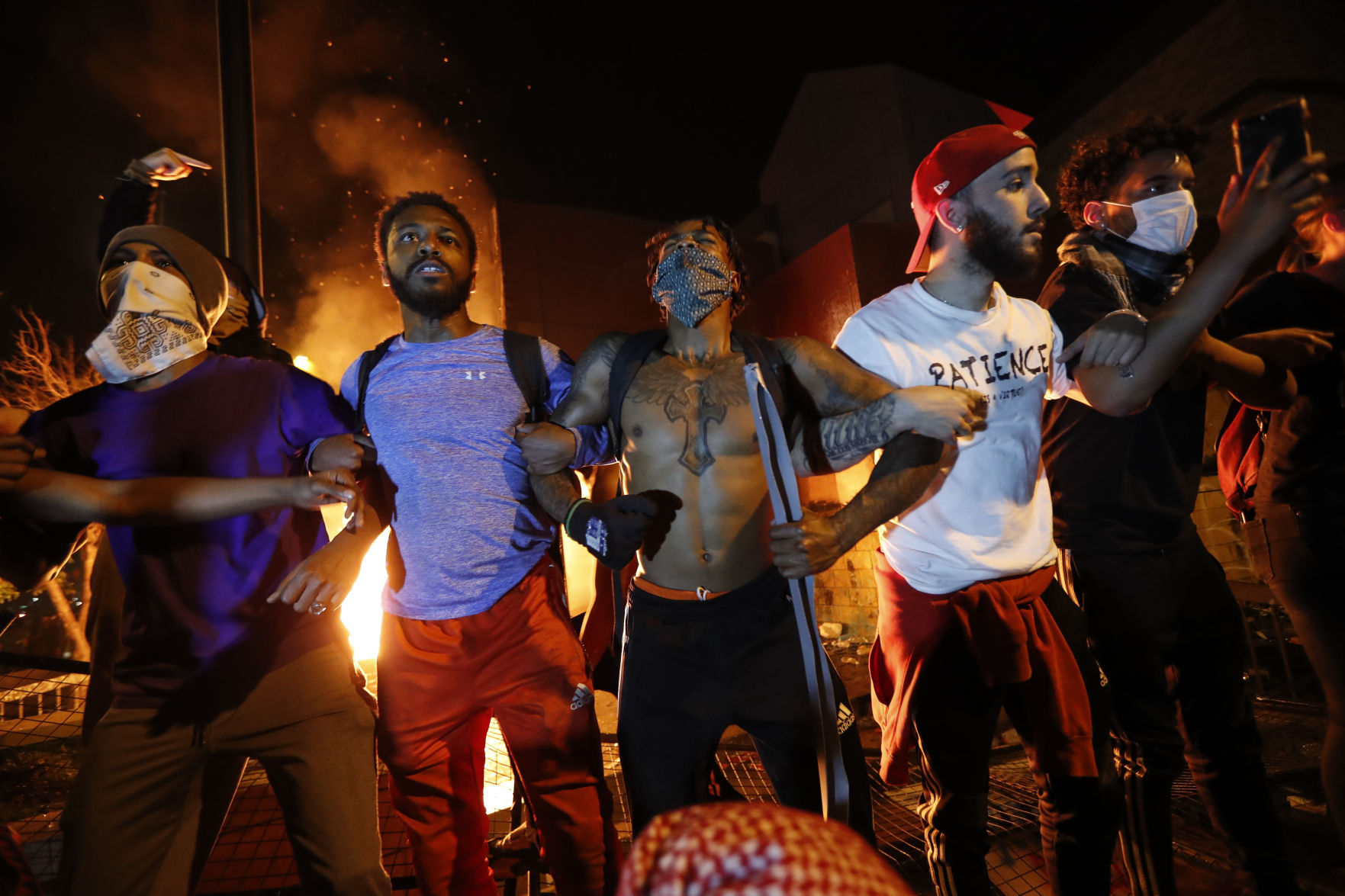 George Floyd protesters set Minneapolis police station afire